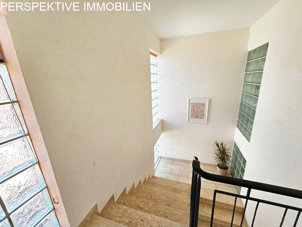 Vermietetes Mehrfamilienhaus + Baugrundstück und Garagen