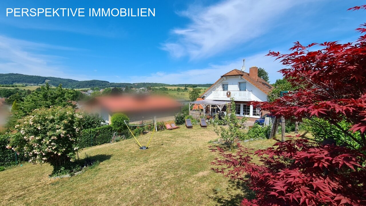 Romantisches Einfamilienhaus mit Einliegerwohnung und traumhaftem Garten